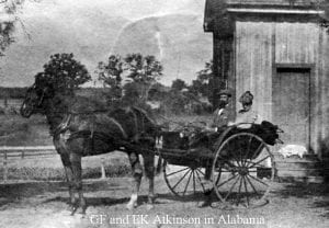 old black and white photo of couple in horsedrawn cart